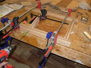 Drilling out the pilot holes for the screws