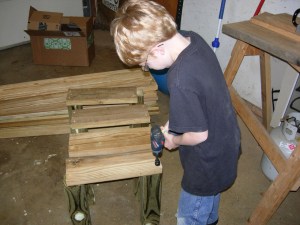 Adam helps pre-drill ends