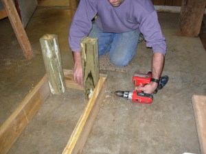 Screwing together the legs to the frame