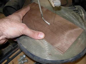 Cutting the cover on the scroll saw