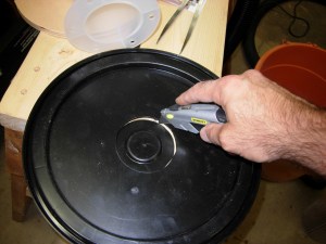 Cutting out the hole in the lid