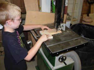 Adam using the bandsaw