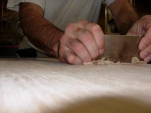 Scraping off the excess filler