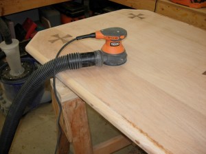 Sanding down the wood filler