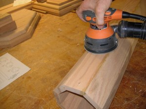 Sanding down the wood filler