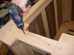 Screwing down the top plate