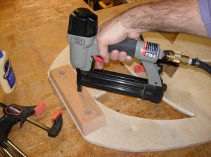 Brad nailing it in place