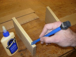 Applying glue to the back of the side pieces