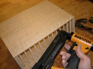 Pin nail in each dowel on front panel