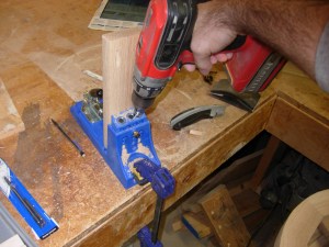 Drilling holes in the cross-brace