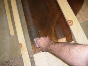 Sanding the finished areas to receive glue