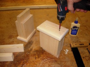 Screwing on the feet