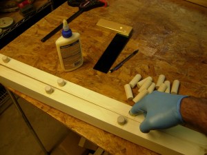 Applying glue and installing the pegs