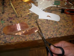 Trimming adhesive backed copper
