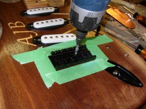 Screwing the bridge in place