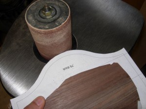 Running it along the spindle sander