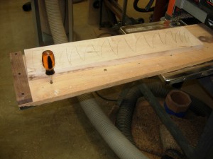 Adjusting the screws to level the maple