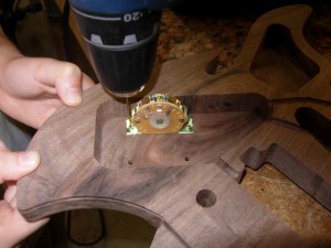 Locating and drilling screw holes