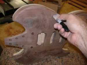 Sandpaper wrapped around a marker fits perfectly