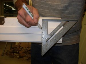 Mark the bottom of the door jamb