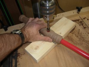 Re-drill hole through tube