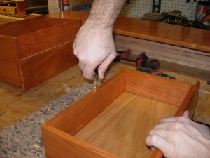 Adding the brass screw