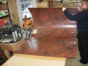 My lovely assistant helps lay down the formica