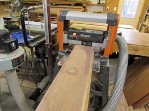 Planing the first side flat