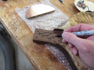 Signing the neck pocket