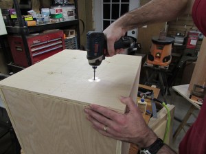 Screwing the bottom to the support posts