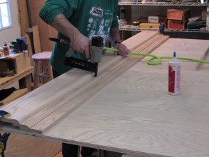 Nailing the long trim piece in place