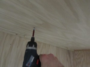 Screwing the verticals in from the bottom