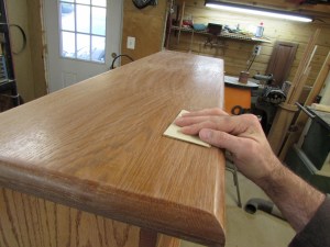 Sanding down the first coat