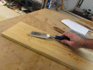 Scraping away the excess glue