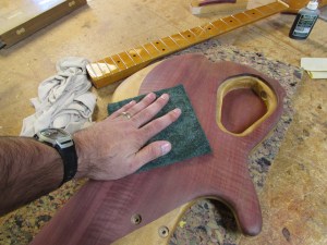 Sanding down the raised grain