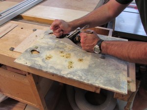 Planing off the excess epoxy