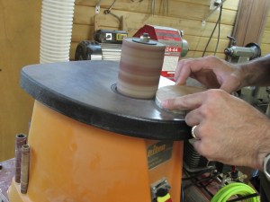 Sanding the burl down to the pattern