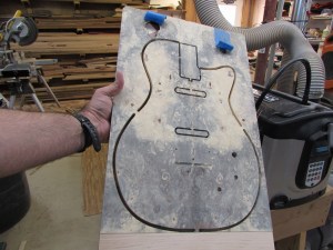 Centered perfectly between the holes and the bottom of the burl